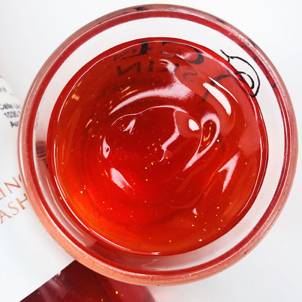 Tiger Roar Body Wash pictured is a cup of our red orange tiger roar body wash against a white background