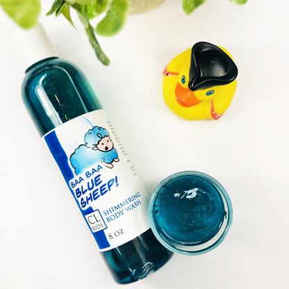 Blue Sheep Shimmering Body Wash in a transparent bottle and cup of our blue sheep body wash against a white background