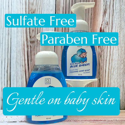 Two bottles of baby soap with 'Sulfate Free', 'Paraben Free', and 'Gentle on baby skin' text on a wooden background.