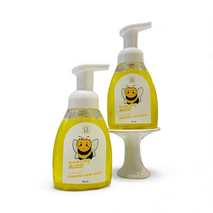 Two bottles of CL Bumblebee Buzz foaming hand soap on a white background