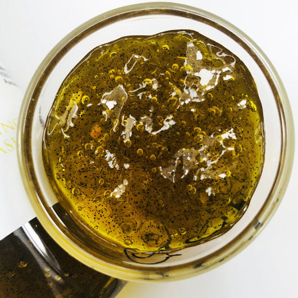 Bumblebee Buzz Shimmering Body Wash in a cup of our golden yellow bumblebee buzz body wash against a white background