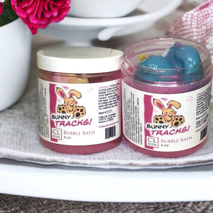 Two jars of Bunny Tracks bubble bath on a surface with a blurred background