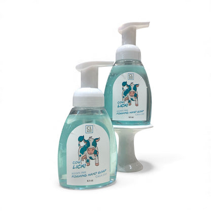 Two bottles of CL Kids Cow Lick hand soap on a white background