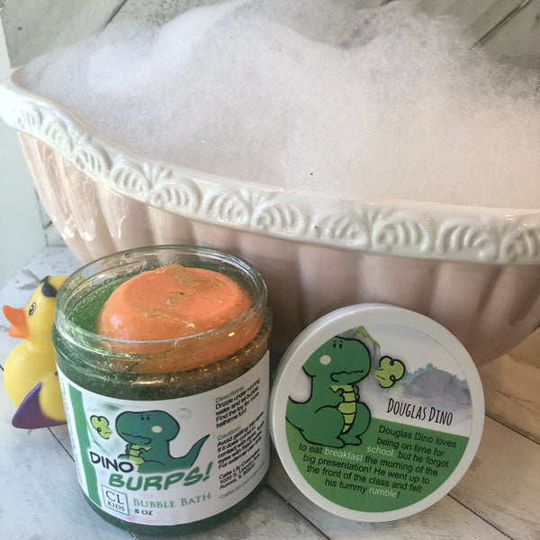 Jar of bubble bath with a dinosaur label next to a tub filled with bubbles.