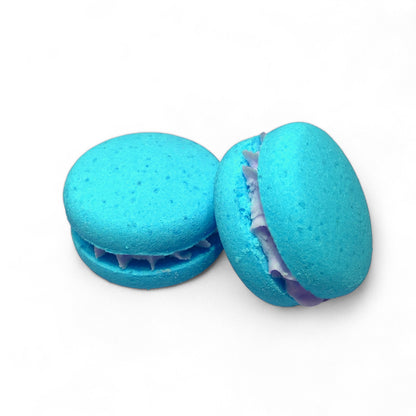 Two teal calla cow bath cookies against a white background