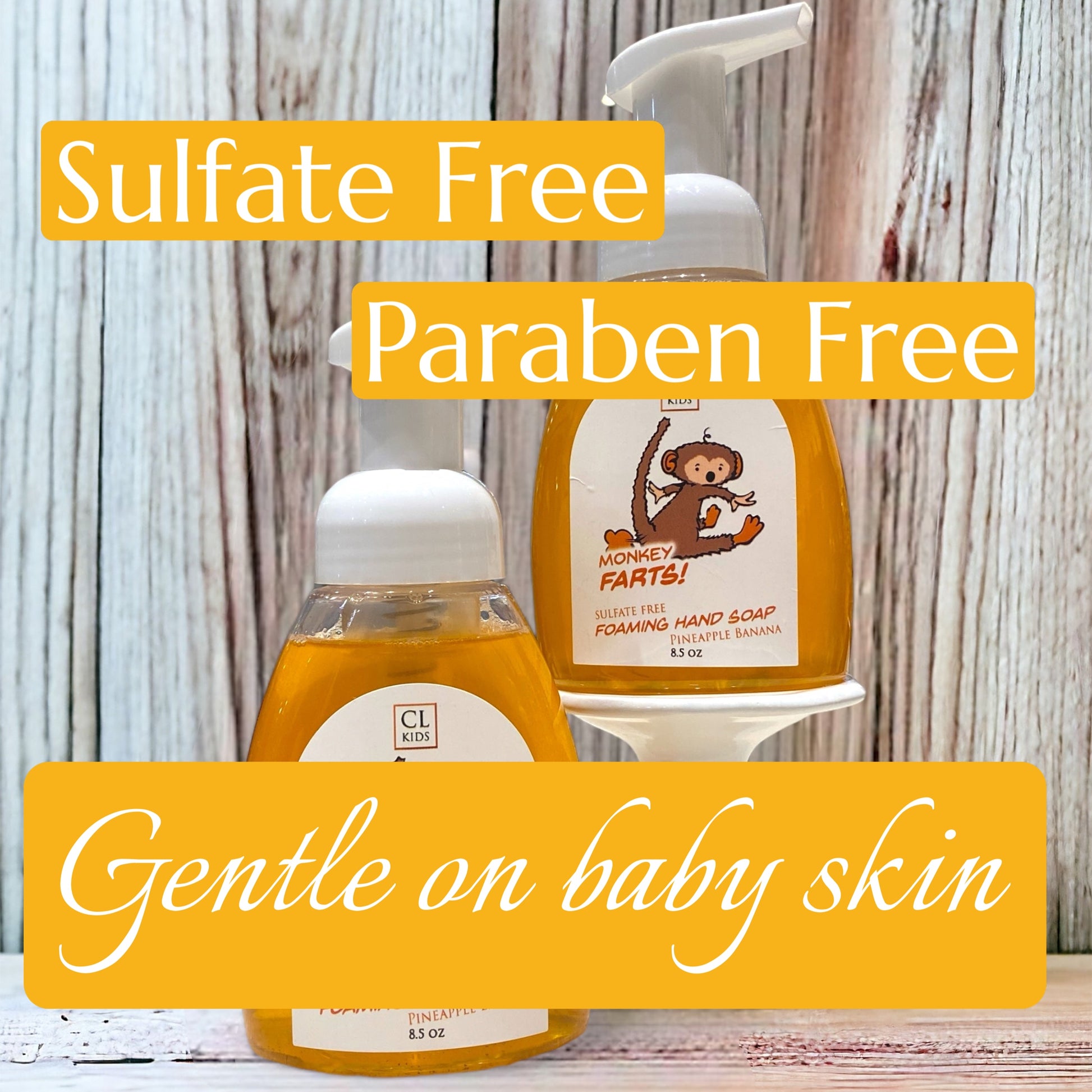 Hand soap and hand lotion with 'Sulfate Free', 'Paraben Free', and 'Gentle on baby skin' text on a wooden background.