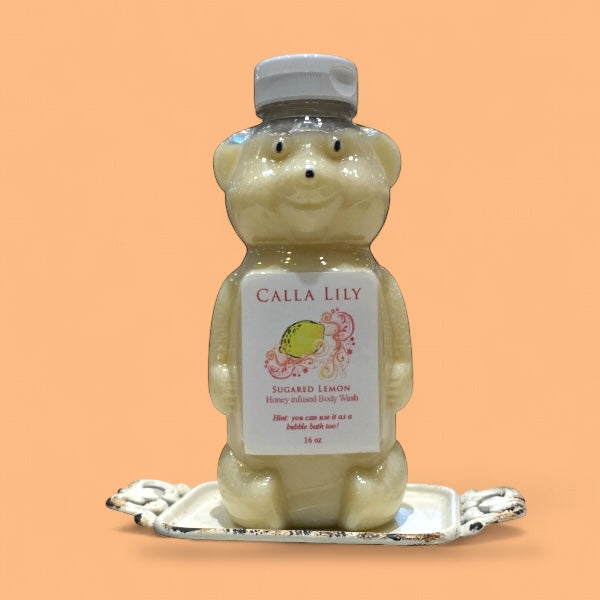 Bear-shaped bottle of Calla Lily Sugared Lemon product on a peach background