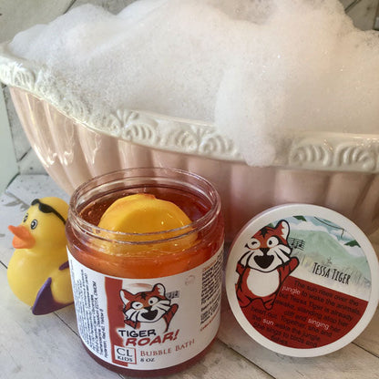 Jar of bubble bath with tiger branding next to a rubber duck and soap dish.